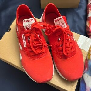 Red Reebok classic nylon sneakers